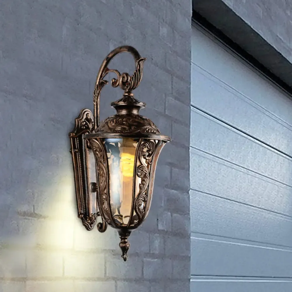 Bronze Metal Outdoor Wall Sconce with Curved Arm, Amber Glass Shade - 1-Light Wall Lamp