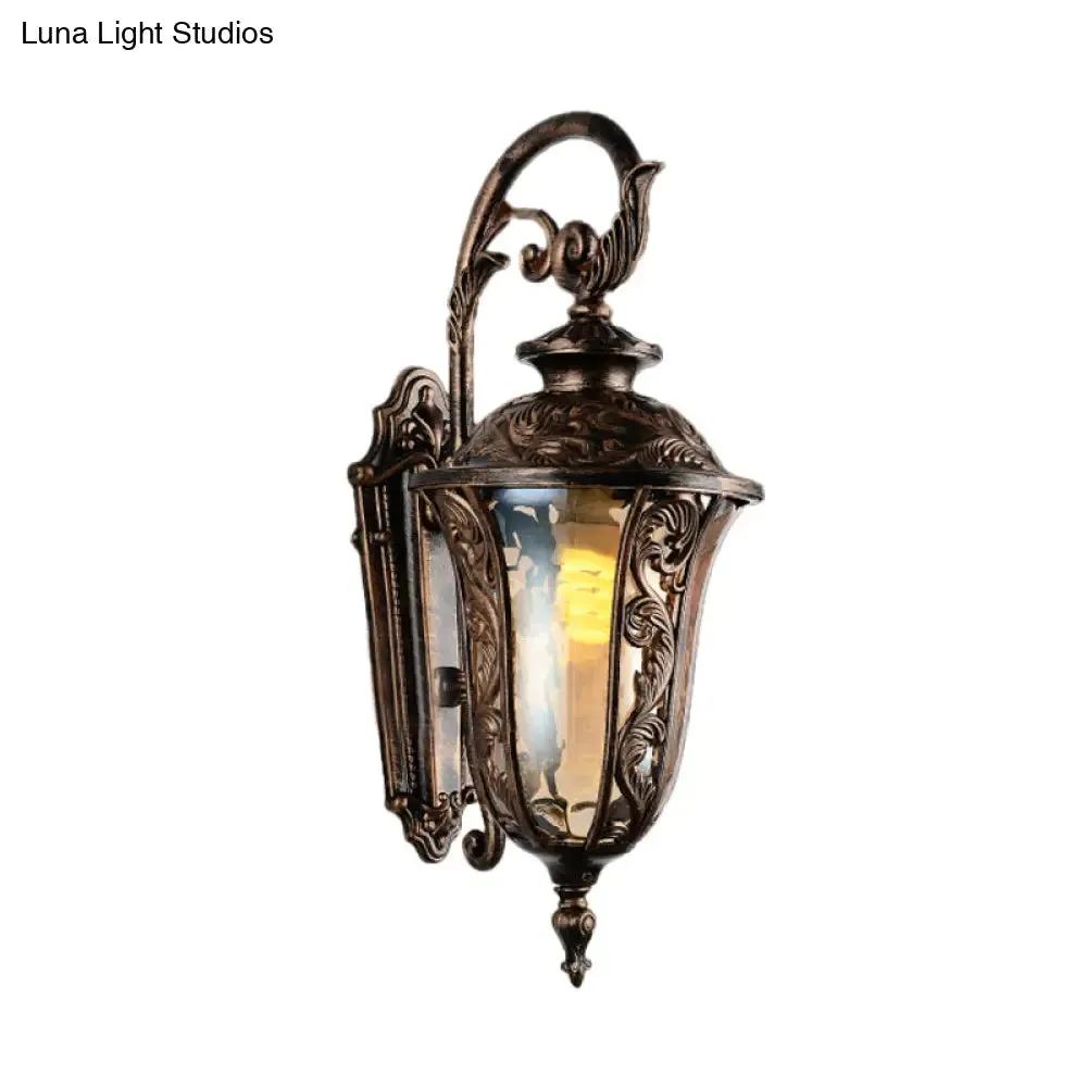 Bronze Metal Outdoor Wall Sconce with Curved Arm, Amber Glass Shade - 1-Light Wall Lamp