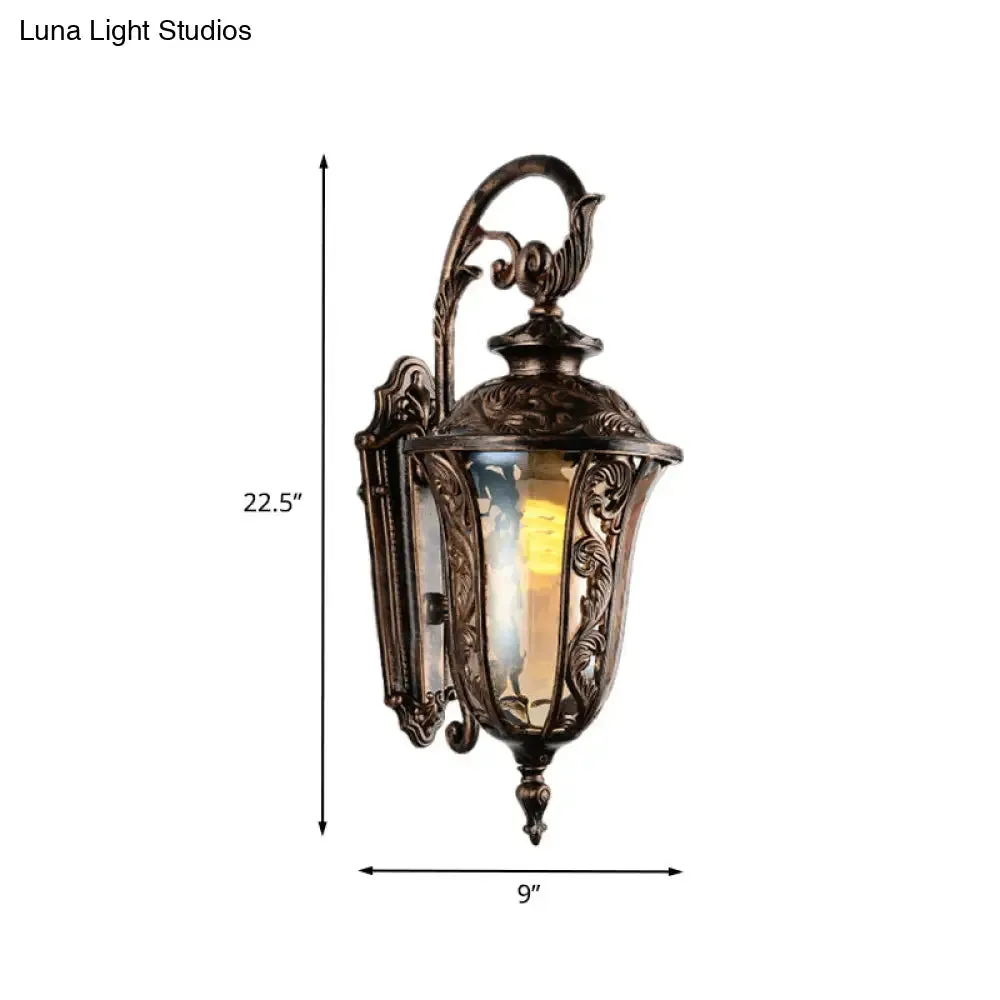 Bronze Metal Outdoor Wall Sconce with Curved Arm, Amber Glass Shade - 1-Light Wall Lamp