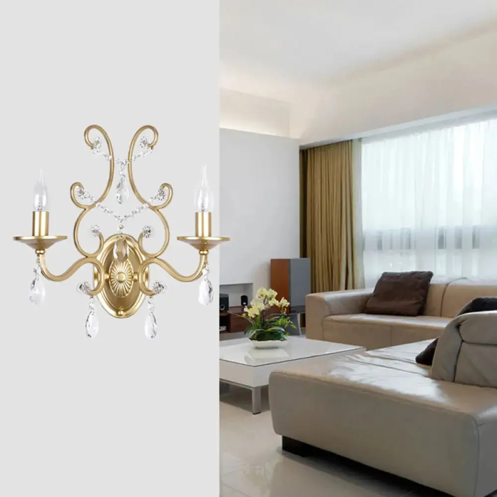 Contemporary Crystal Wall Sconce with Curved Arm and Brass Finish