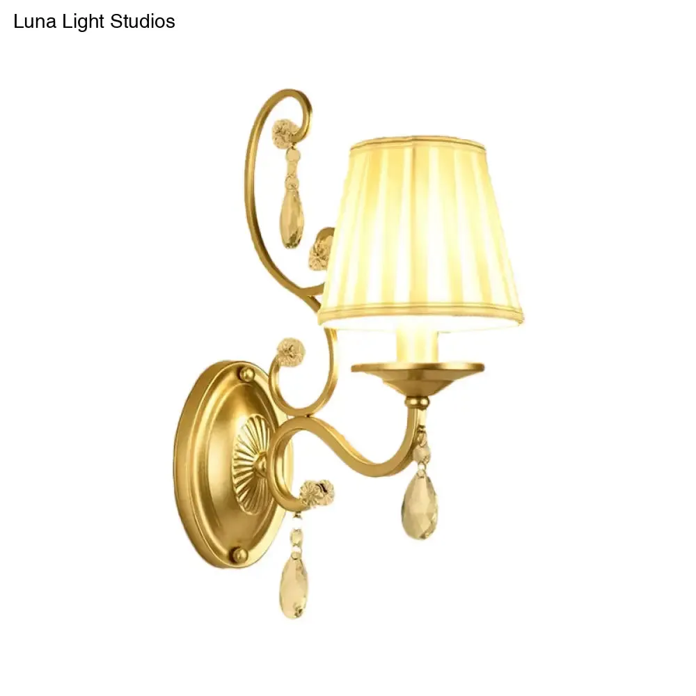 Contemporary Crystal Wall Sconce with Curved Arm and Brass Finish