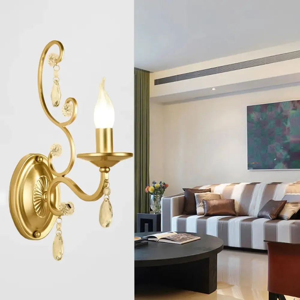 Contemporary Crystal Wall Sconce with Curved Arm and Brass Finish