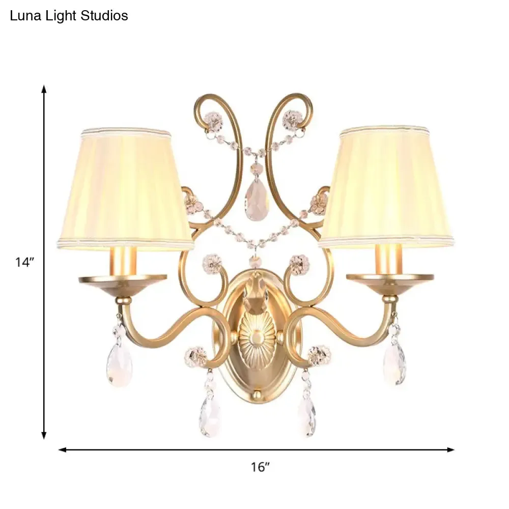 Contemporary Crystal Wall Sconce with Curved Arm and Brass Finish