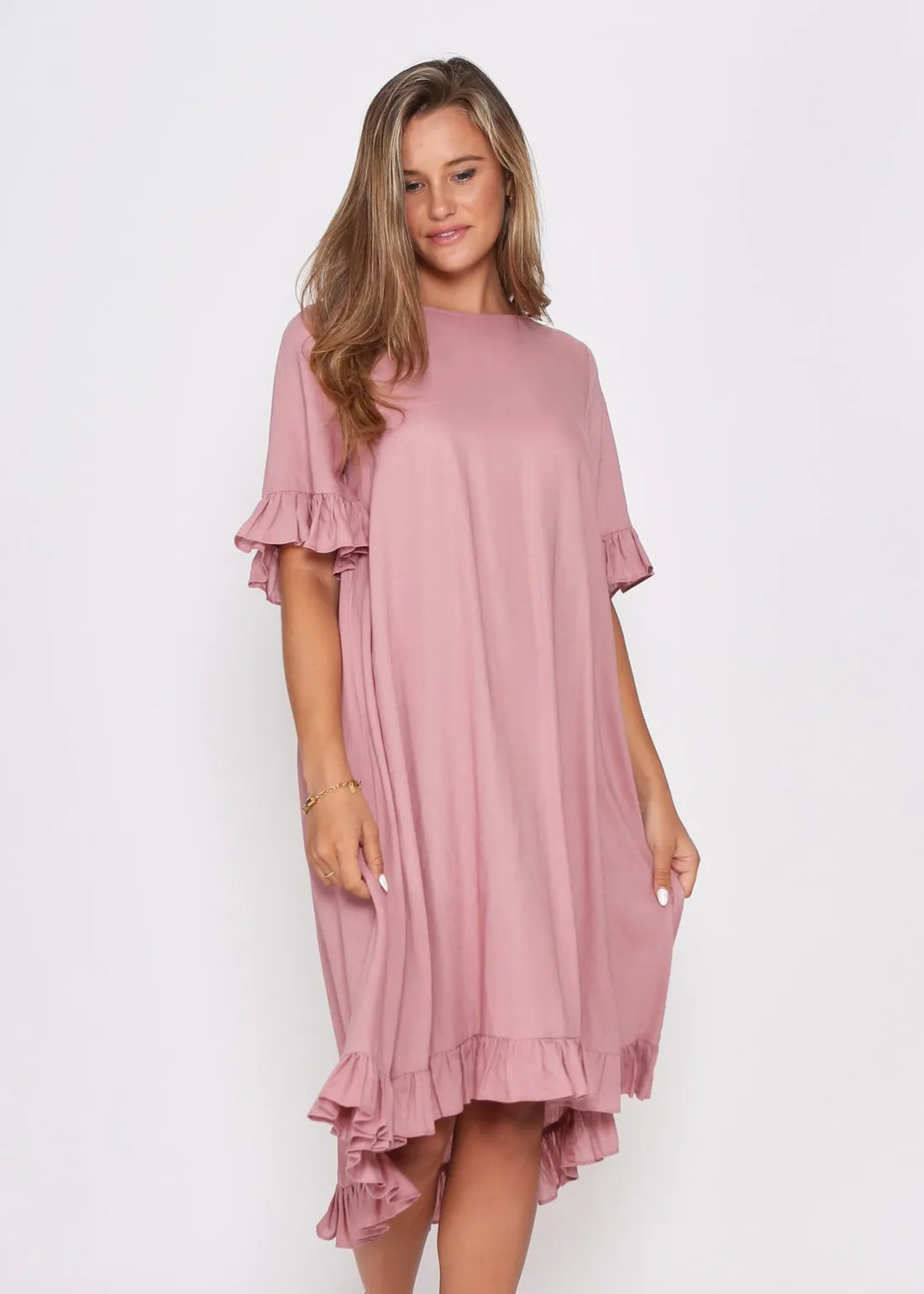 Dusky Pink Dress with pretty sleeve detail and hem line.