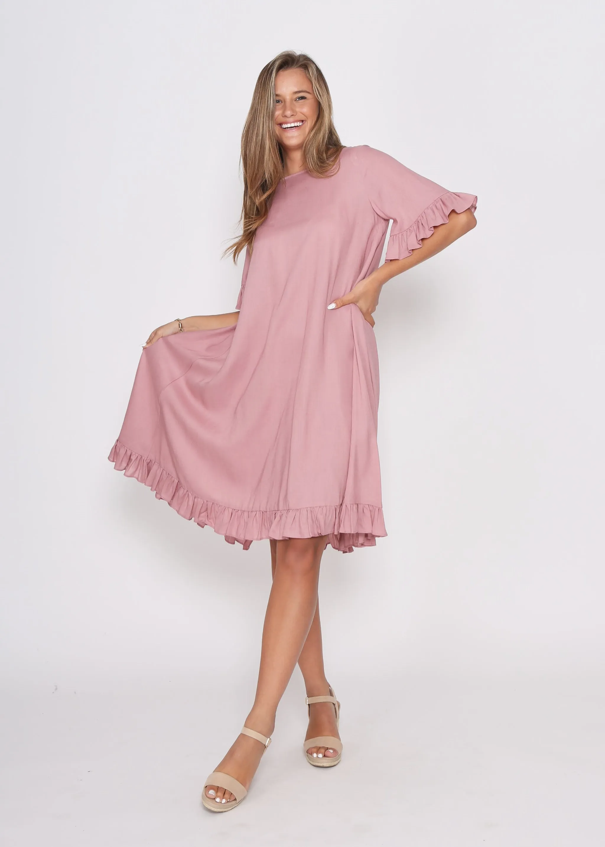 Dusky Pink Dress with pretty sleeve detail and hem line.