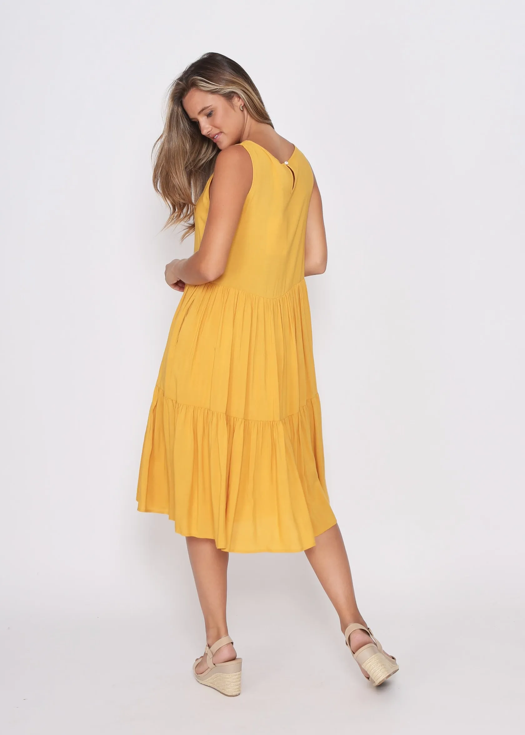 Mustard Dress fully Lined with side pockets.