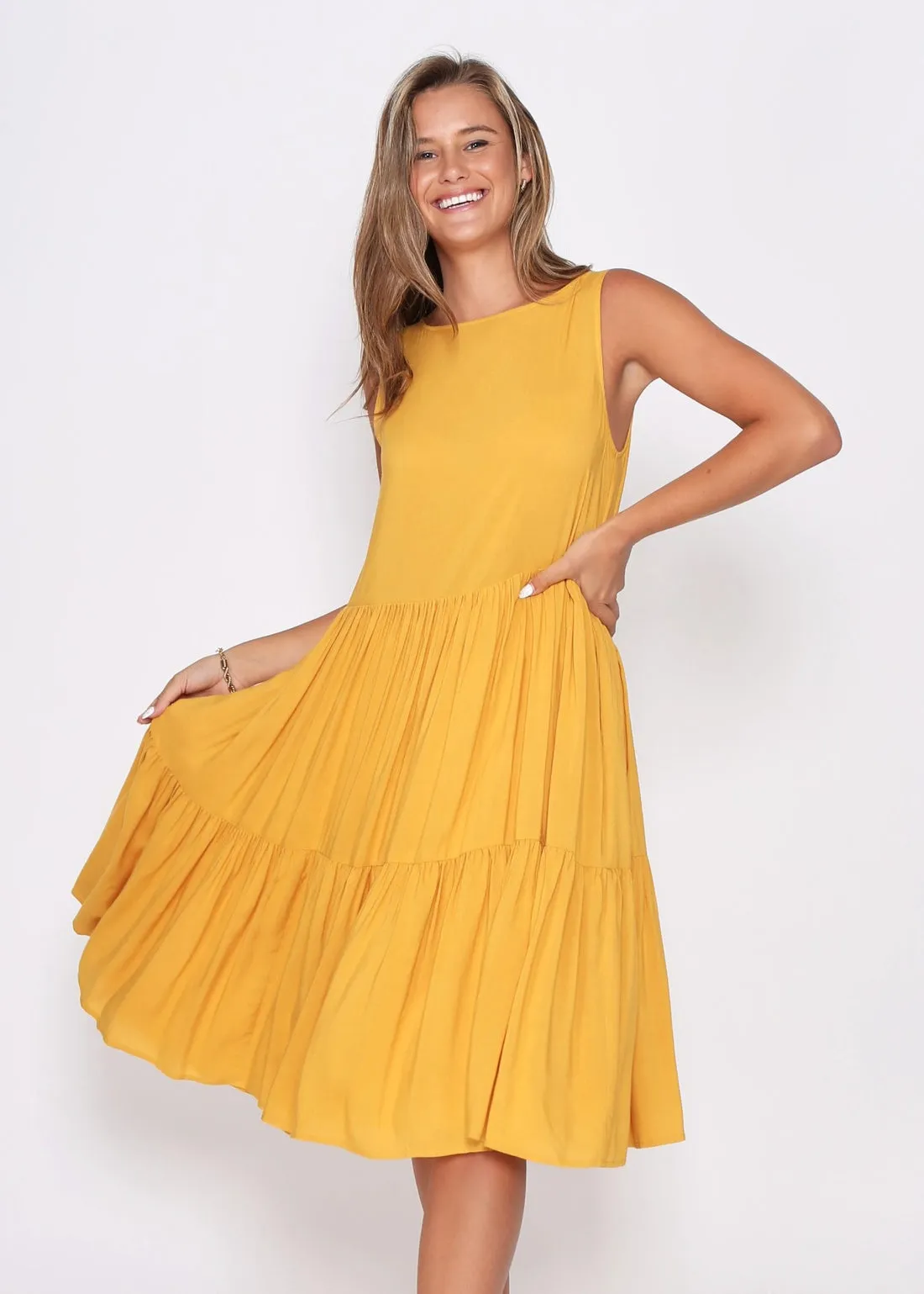 Mustard Dress fully Lined with side pockets.